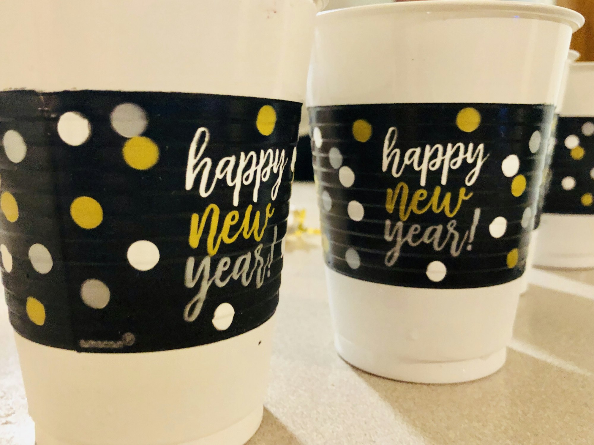 Happy New Years cups on counter at New Year’s Eve party